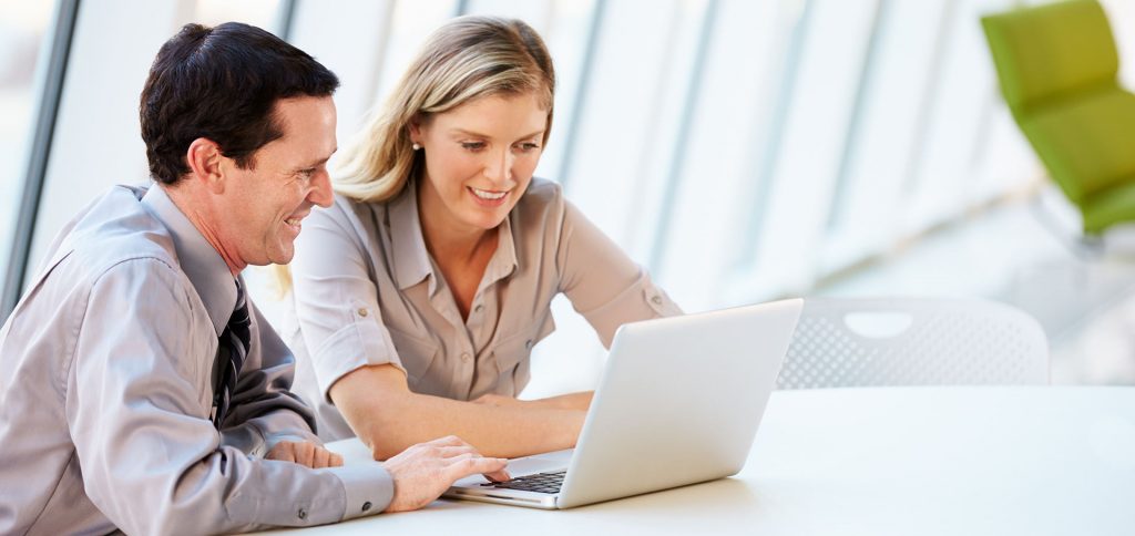 Man and woman working in an office